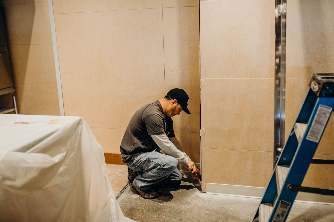 FRP Installer finishing a restaurant wall